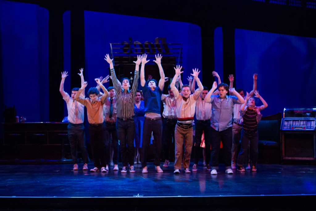 West Side Story - group of kids with hands up singing