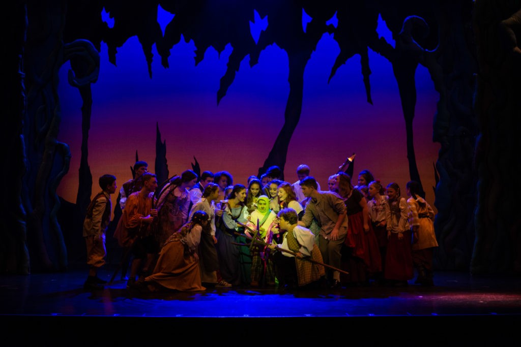 kids on stage in swamp set