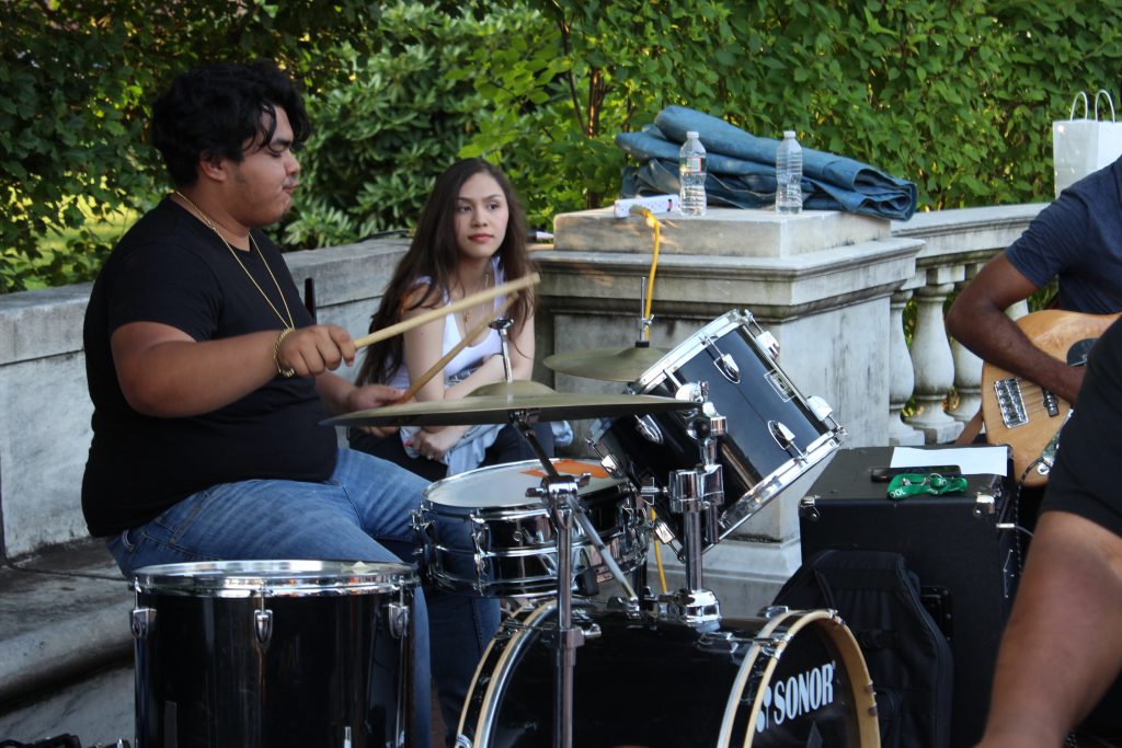 salsa under the stars drummer playing outside