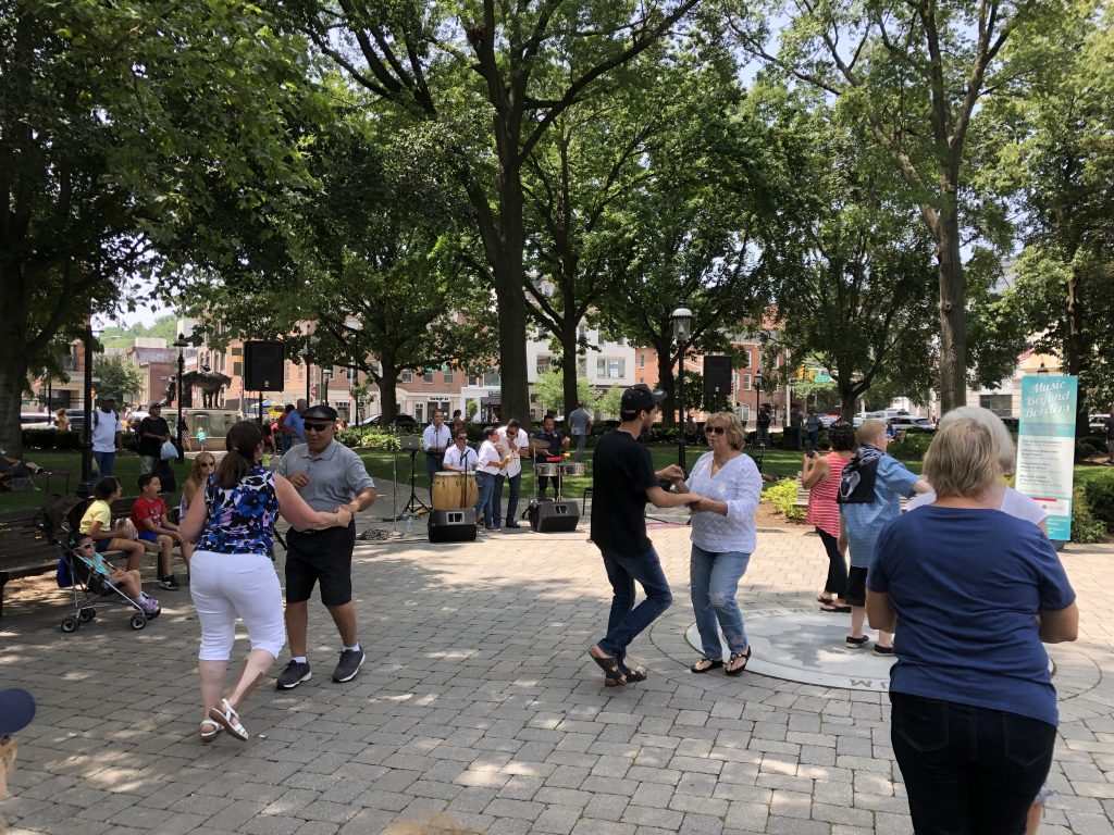 Music Beyond Borders - Grupo Sabor outdoor concert, people dancing