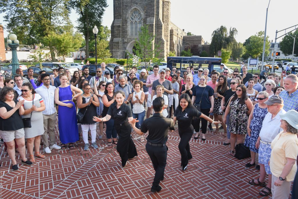 Salsa Under The Stars instructors dancing with attendees