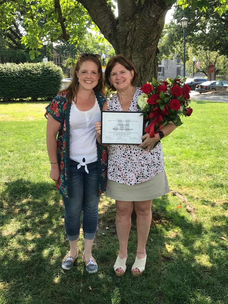 Deb with award at picnic