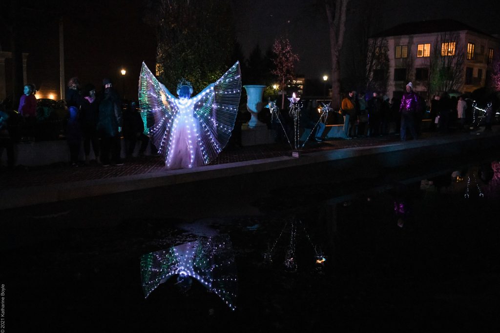 Theatre Of Light Mpac sparkling winged dancer over pool