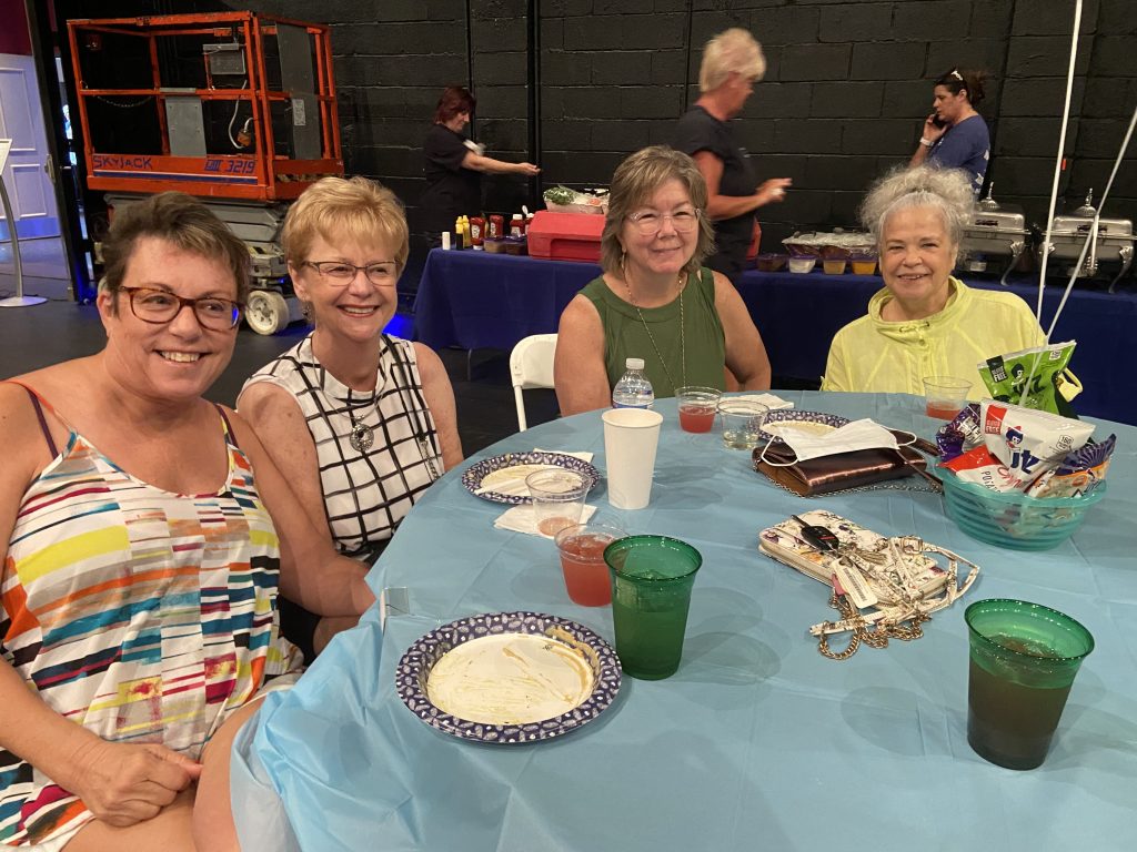 volunteers eating together at volunteer picnic