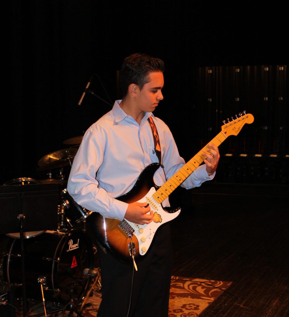 kid playing guitar