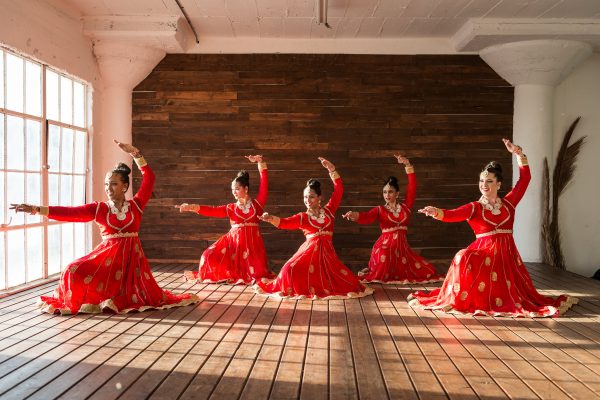 girls dancing in traditional indian garb