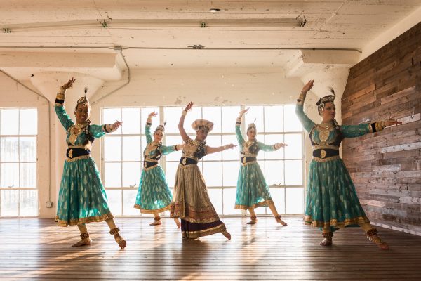 girls dancing in traditional indian garb