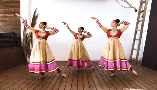 girls dancing in traditional indian garb