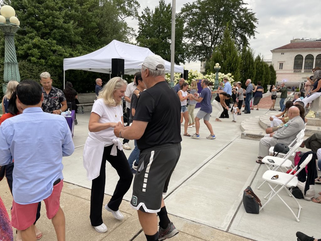 couples dancing at salsa under the stars