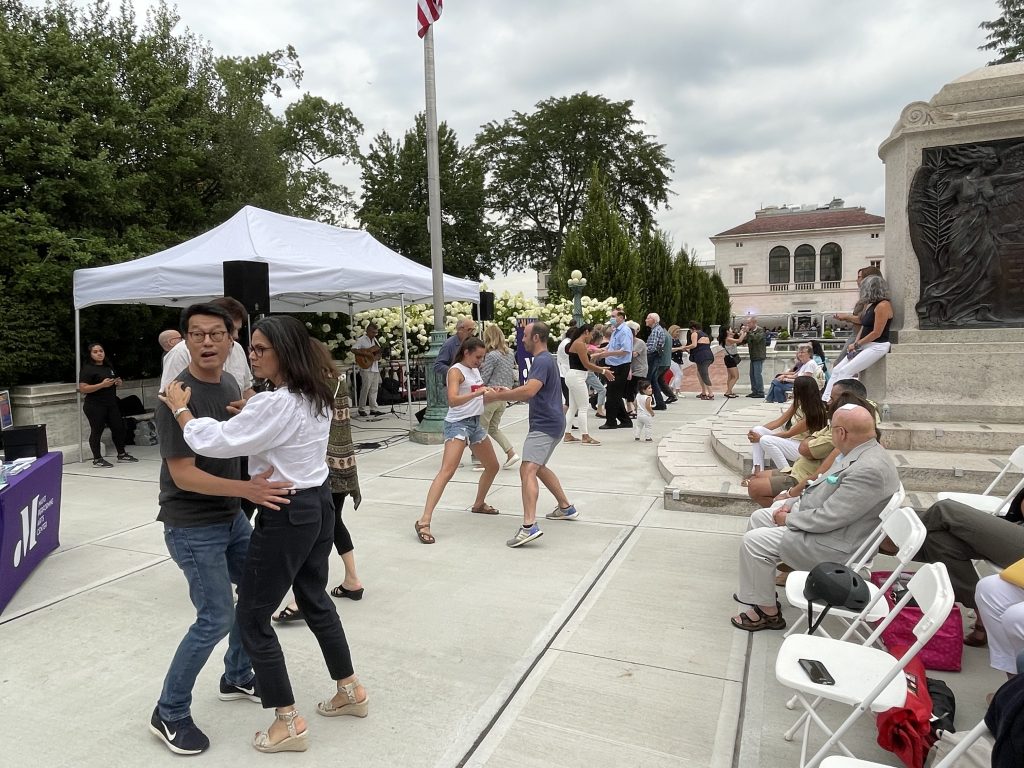 couples dancing at salsa under the stars