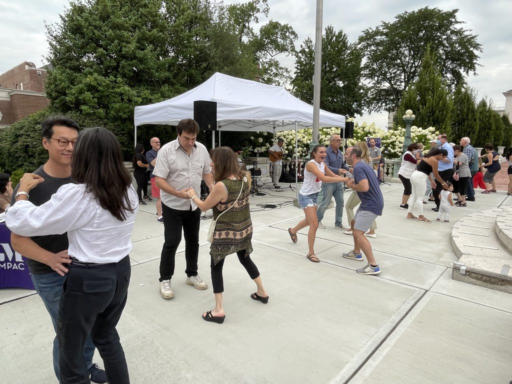 couples dancing at salsa under the stars