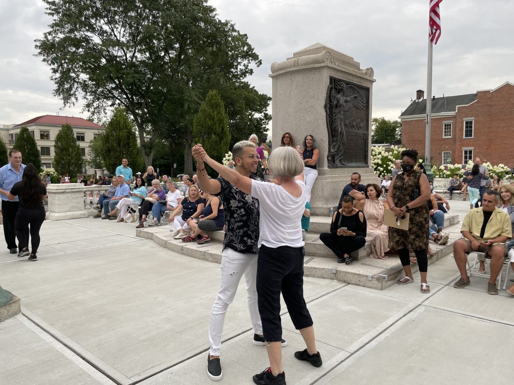 woman dancing with instructor