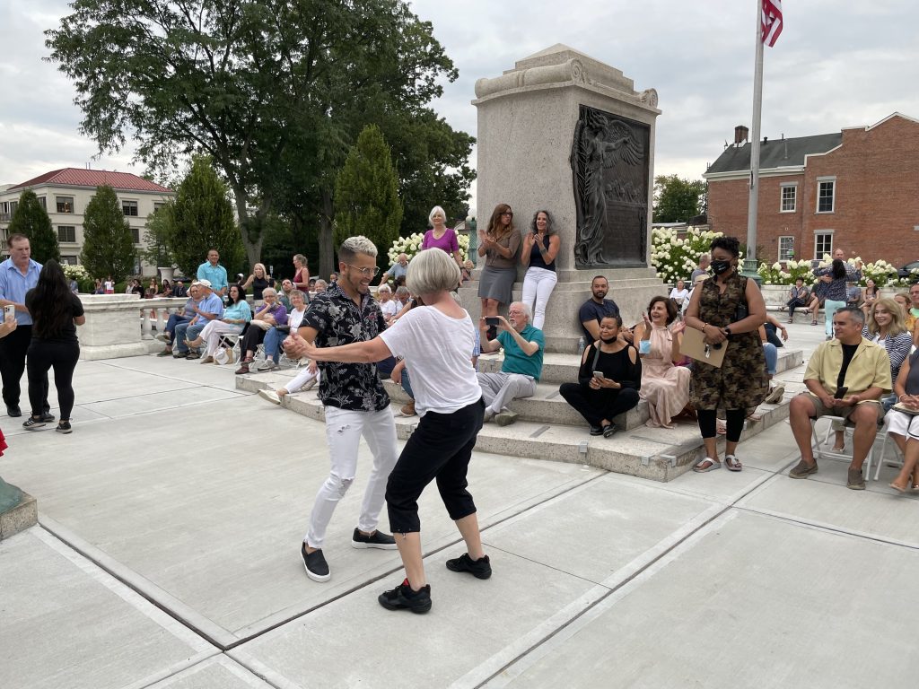 woman dancing with instructor