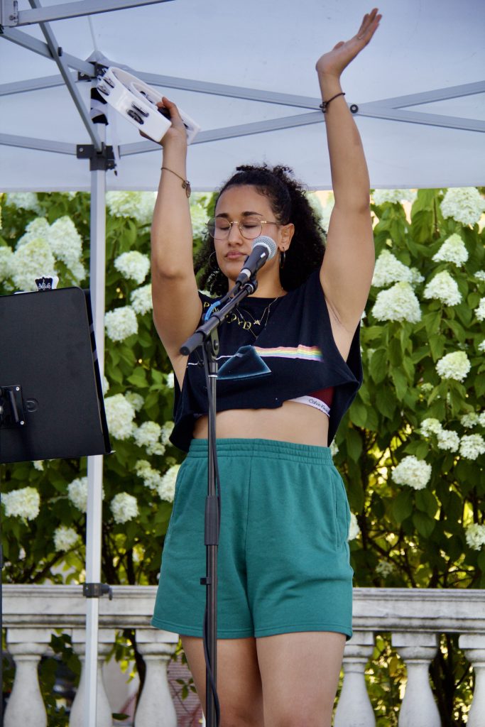 sabrina genesis playing tambourine instrument