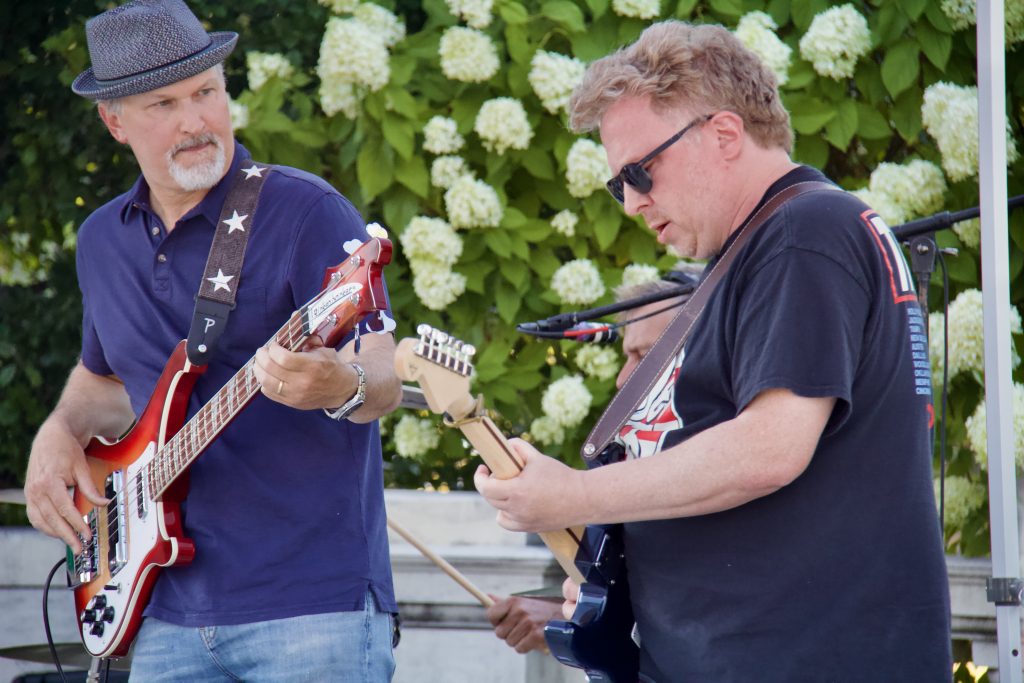 bassist and guitar players playing together