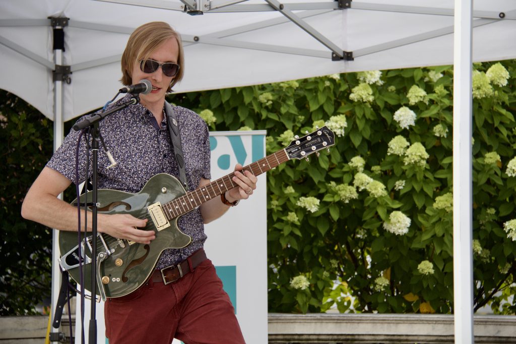 bryan hansen with guitar singing