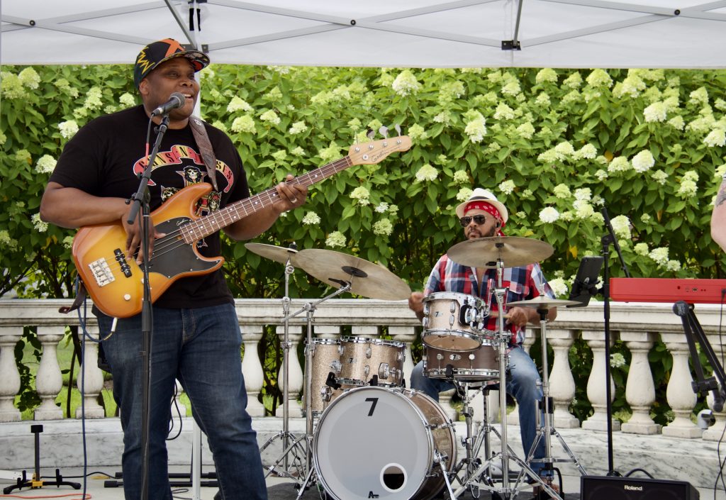 guitarist and drummer performing