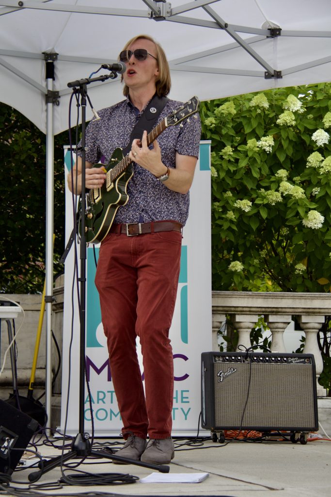 bryan hansen singing with guitar