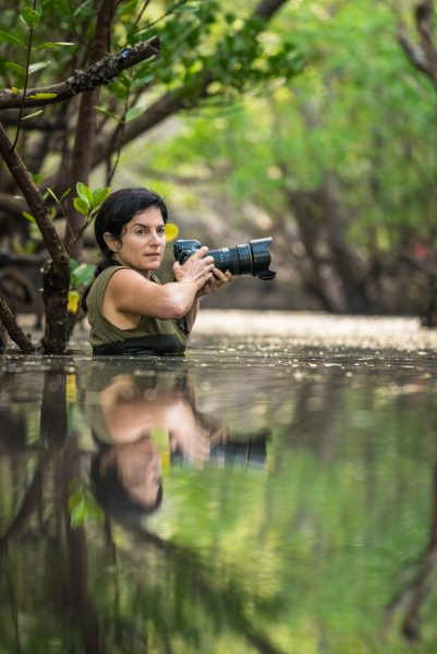 Ami Vitale in water