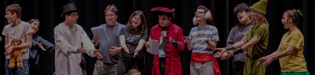 Miracle Project students perform onstage in Peter Pan