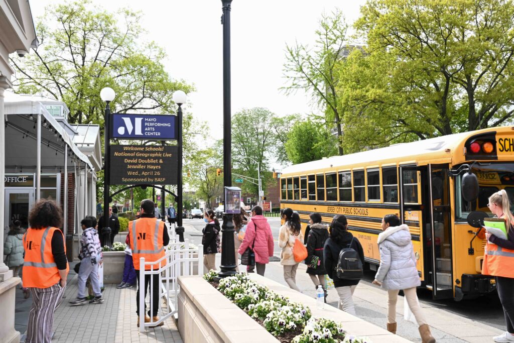 School buses and students arrive for National Geographic field trip at MPAC